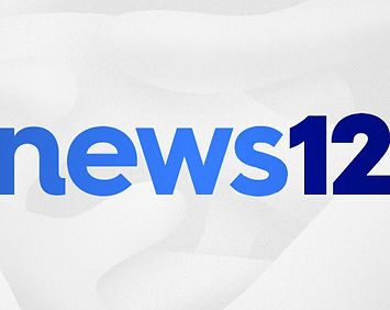 A blue and white logo for news 1 2.