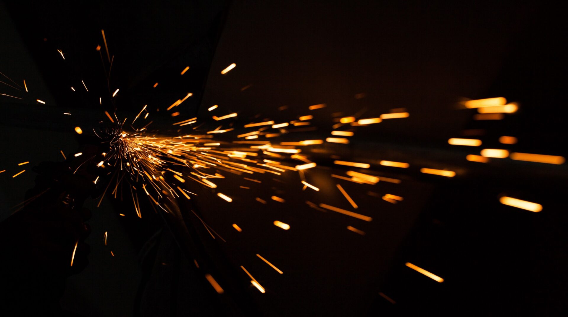 A close up of sparks flying from the side