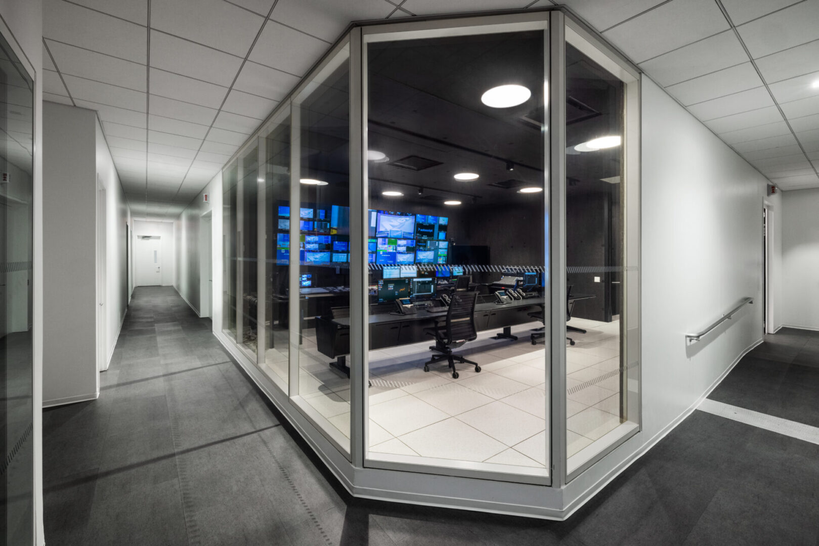 Modern control room with multiple screens.