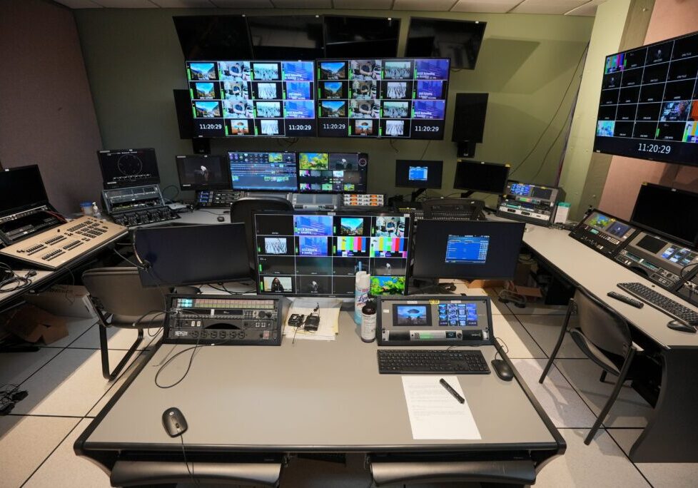 A large room with many different monitors and equipment.